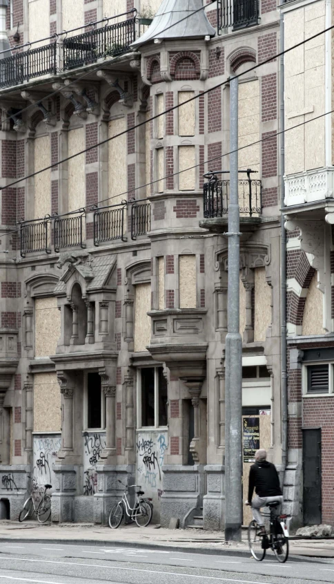 a view from the sky of an old building, including two floors and several balcony areas