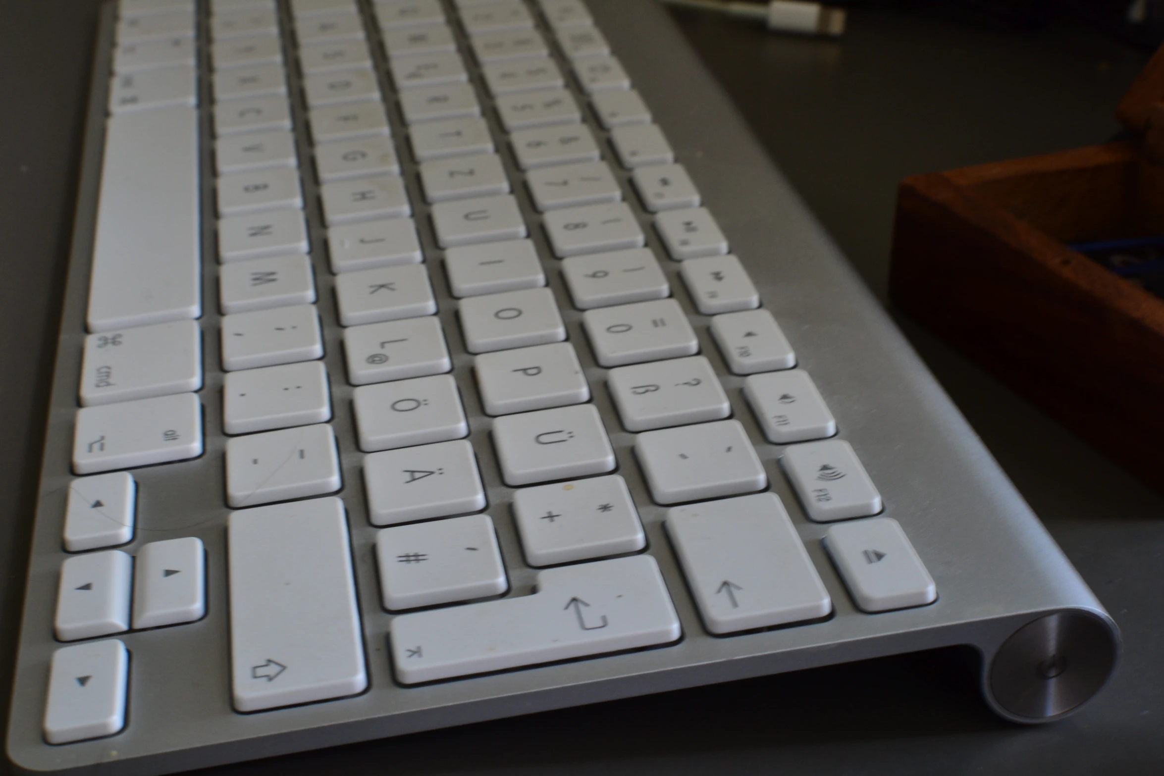 a computer keyboard laying on top of a table