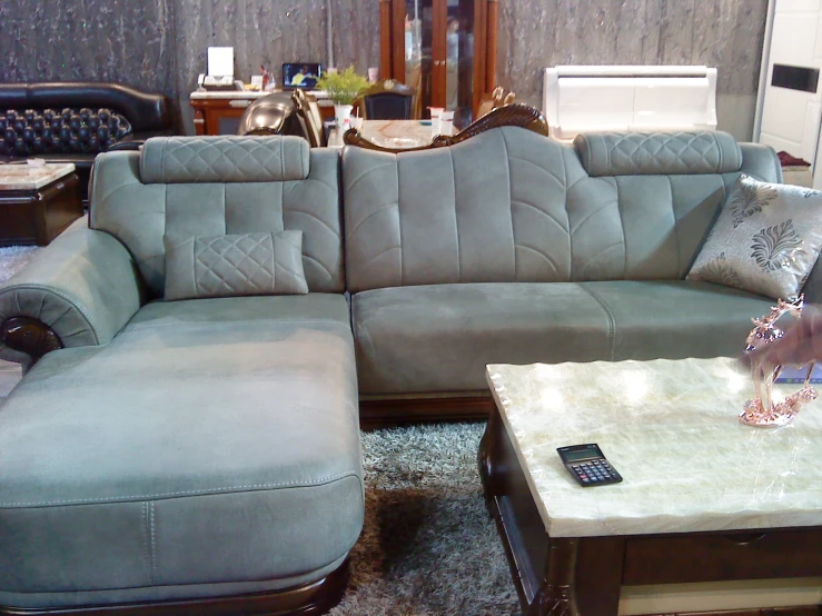 this modern sectional sofa has leather and upholstered cushions