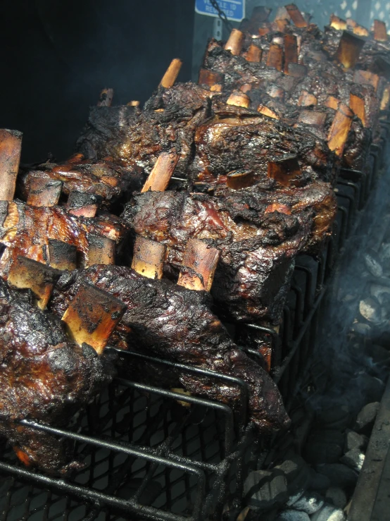 grilled pork sitting on a grill with thick bbq sauce