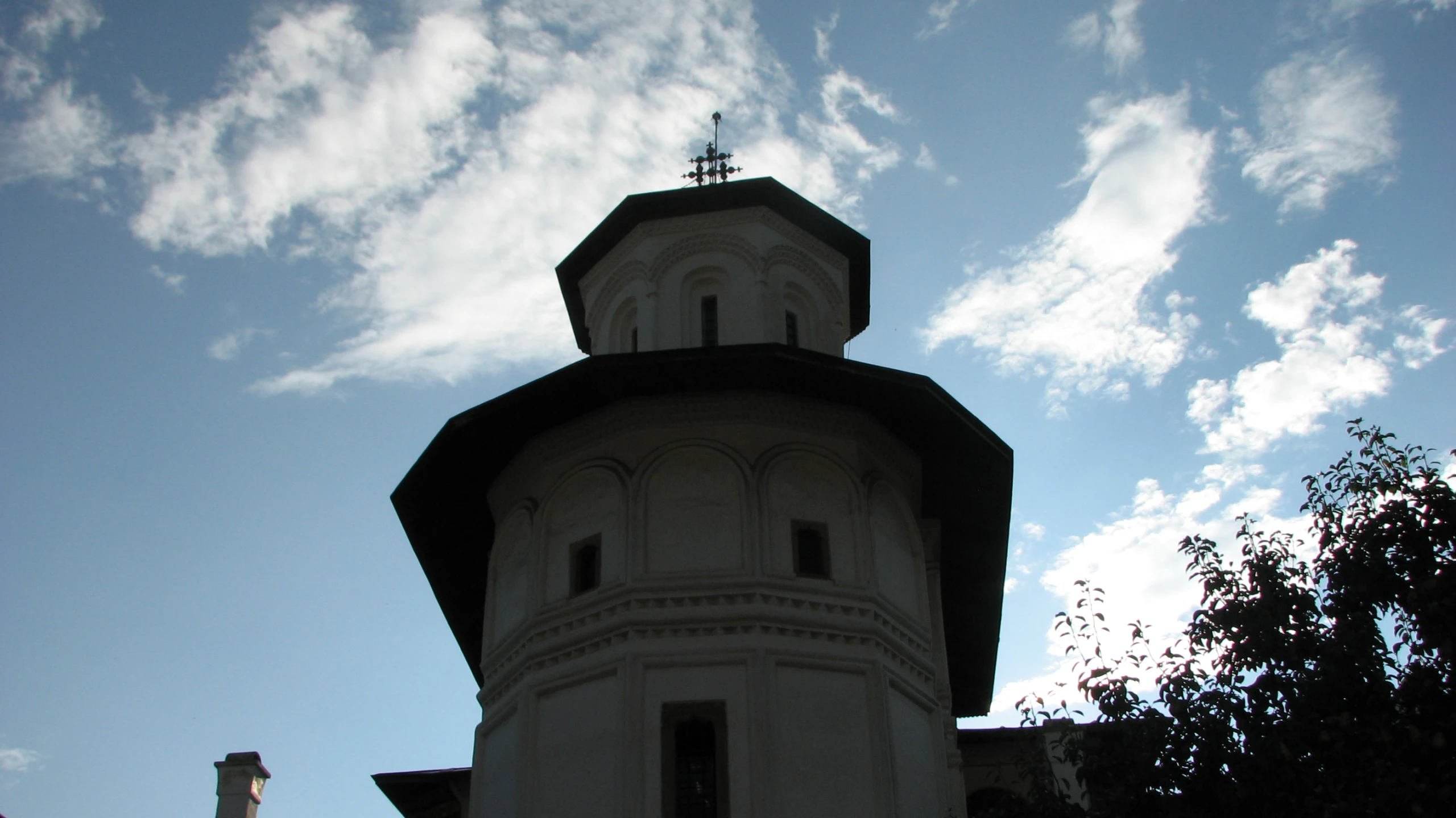 the building is in an old building and looks like it has an old bell tower