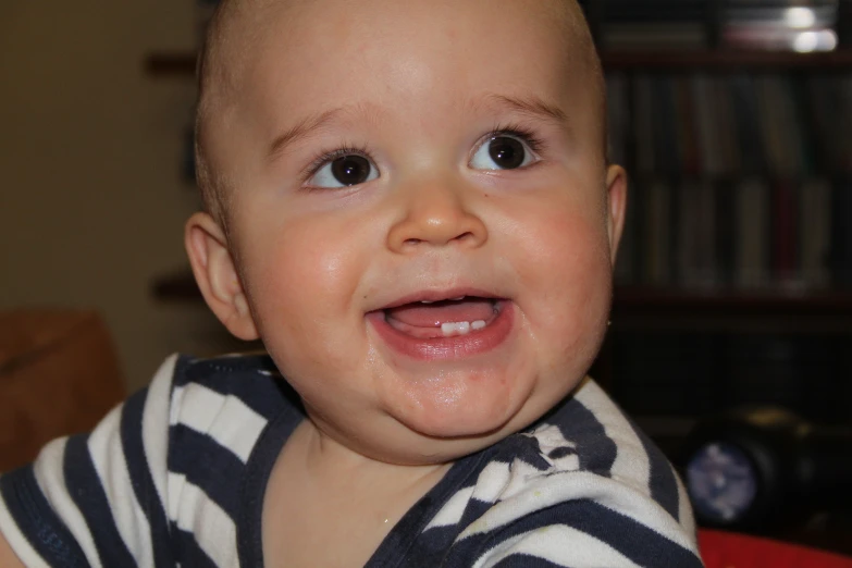 a small child smiling at the camera