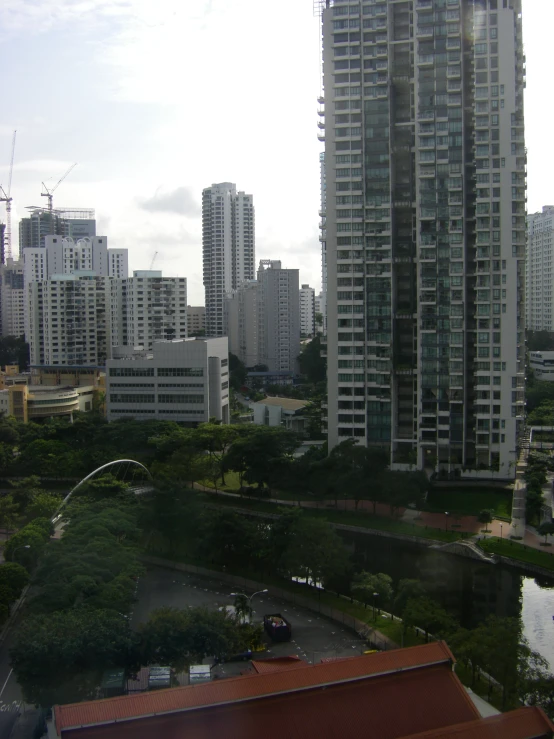 buildings along side a river and a park