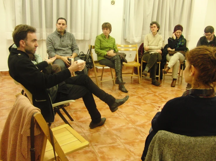 a group of people in an office waiting for their presentation