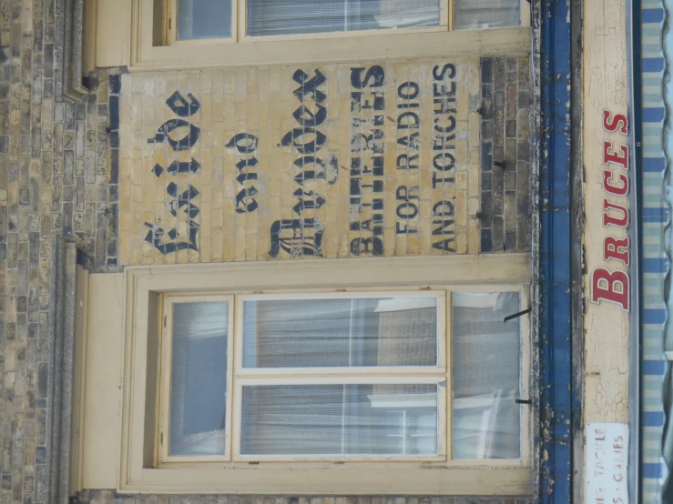 some foreign words and letters on the side of a building