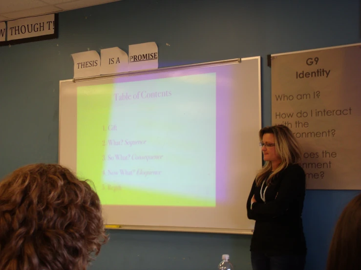 a woman giving a class at a school