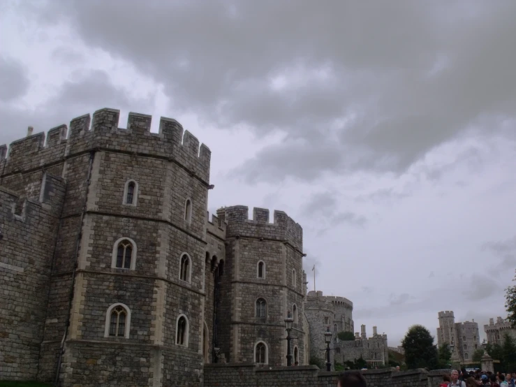 an old castle built into a wall on a cloudy day