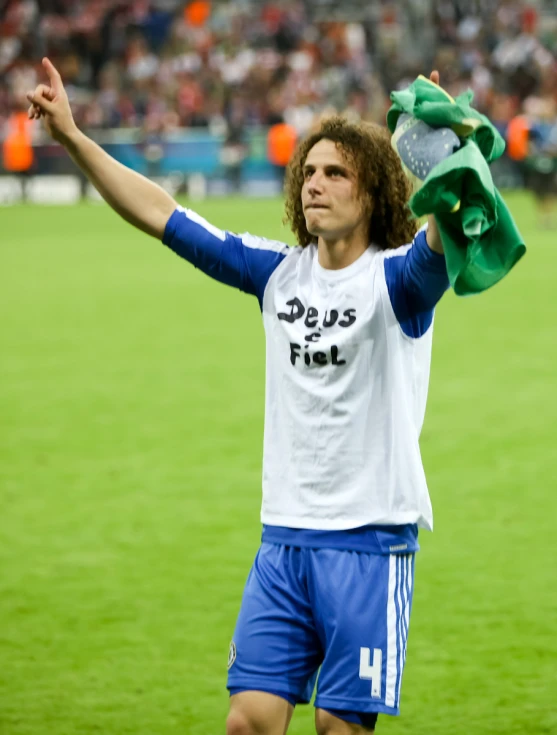 a man is holding soing up during a soccer game