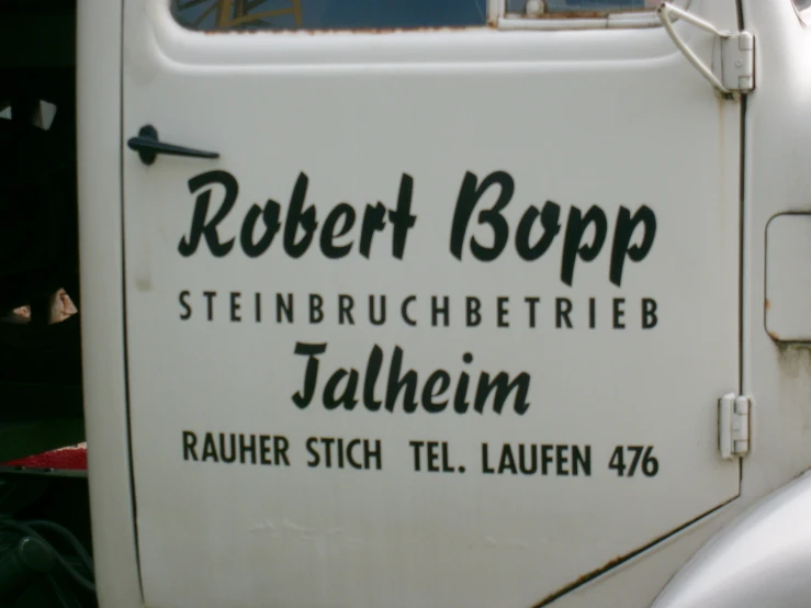 a sign on a white truck advertising robert b popp stein