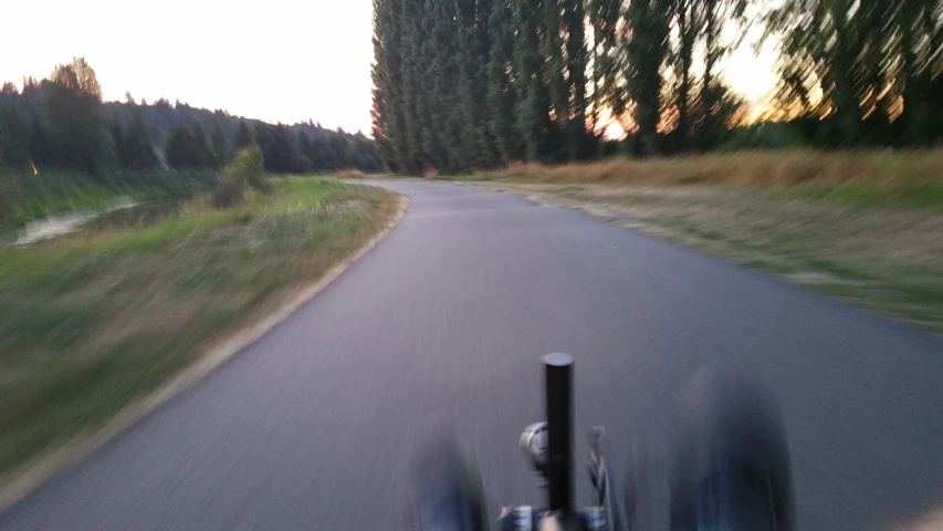 a bicycle rider is going through a curve