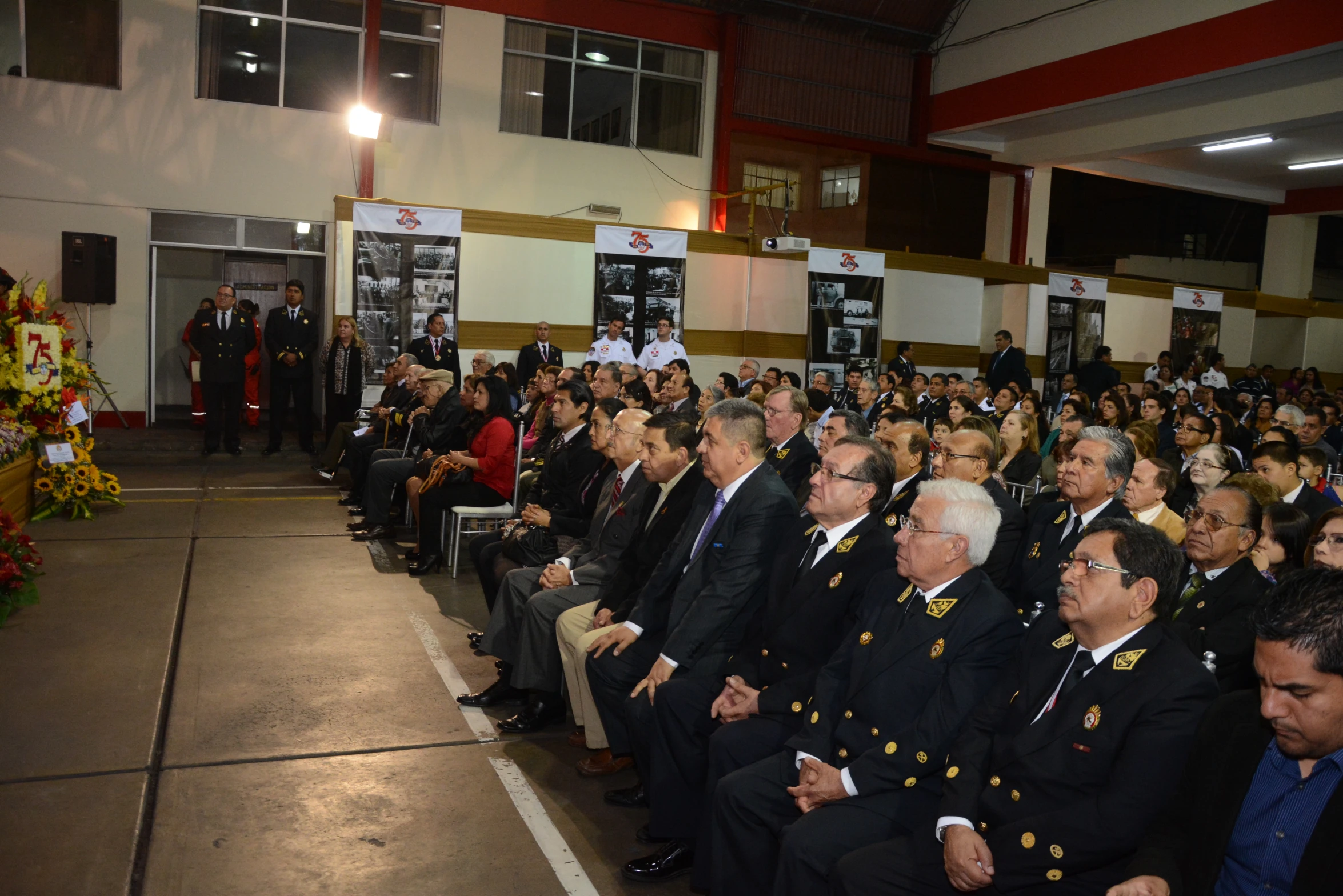 men in suits sitting and standing at the front