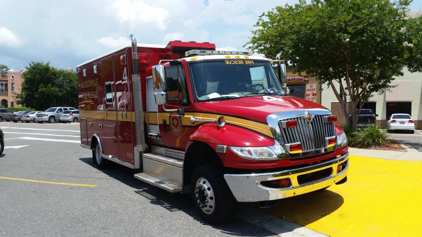 a fire truck parked in the middle of a parking lot