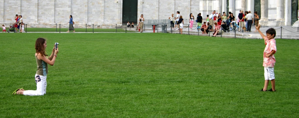 two s standing in the middle of a field