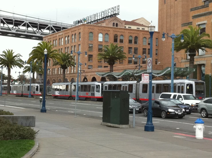 a passenger train traveling through a city street