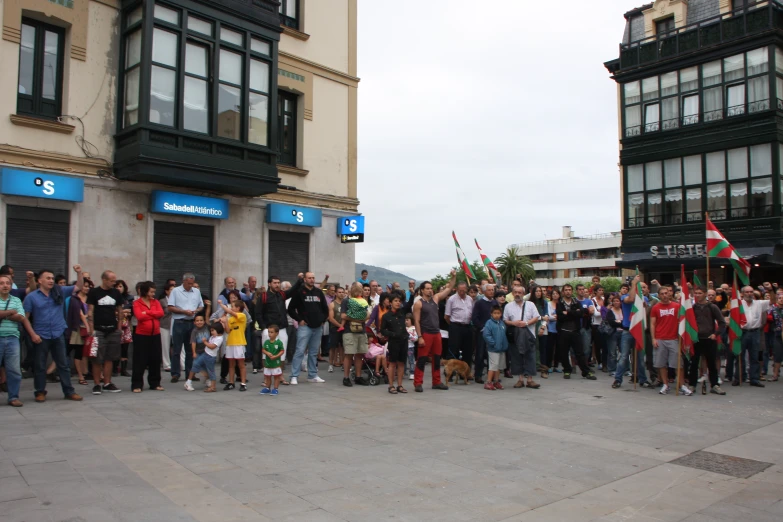 a group of people who are standing in front of buildings