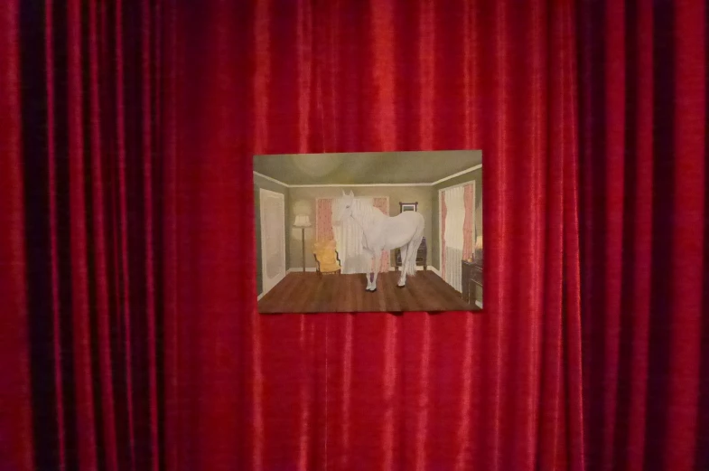 a po of a person standing at an open door in a room with red curtains