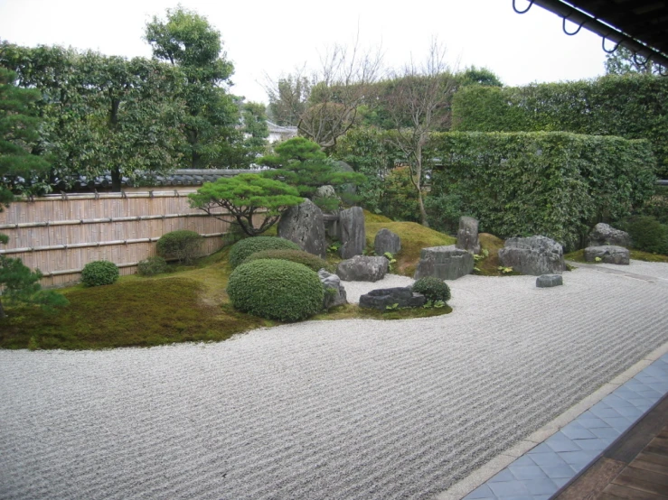 an asian garden scene with moss and stones