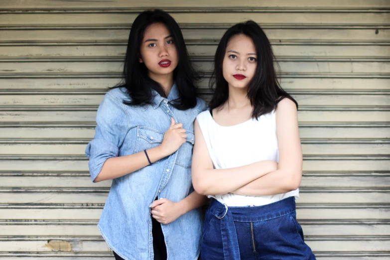 two women are standing next to each other