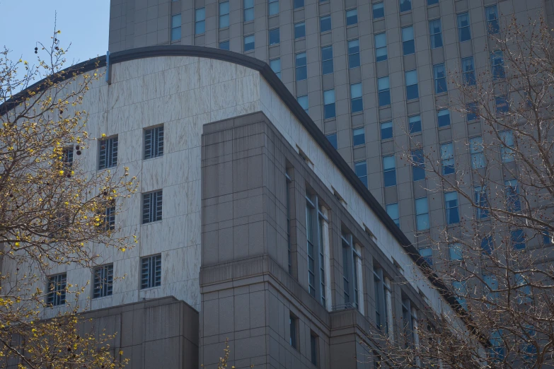 the top of a building in a city with a tall clock on the wall