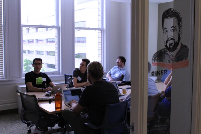 group of people at a table having discussion