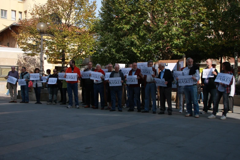 the people are holding signs that say change the world