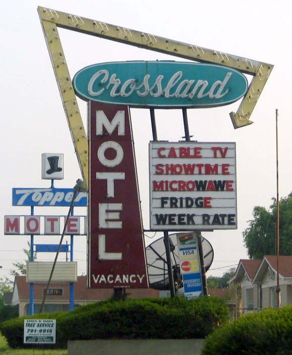 a motel sign stands out in the distance