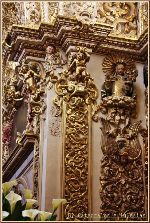 an ornate sculpture in a church with gold accents
