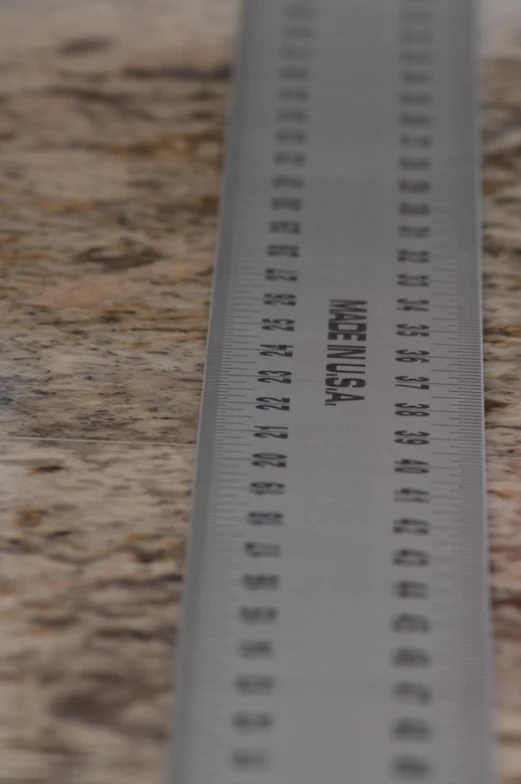 there is a ruler with numbers printed on it