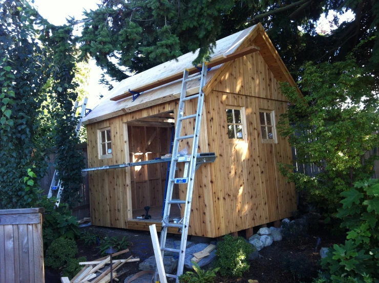 a small cabin that has been constructed on the side of a hill