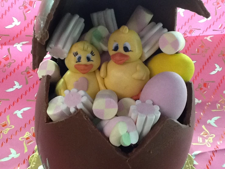 a chocolate easter basket with rubber ducks in it