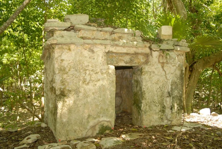 a large stone structure with the door open