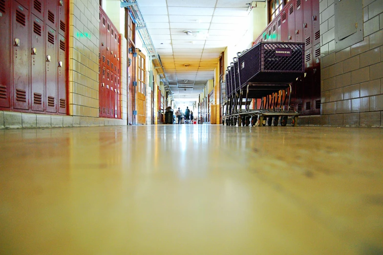 a long hallway with several lockers lined up