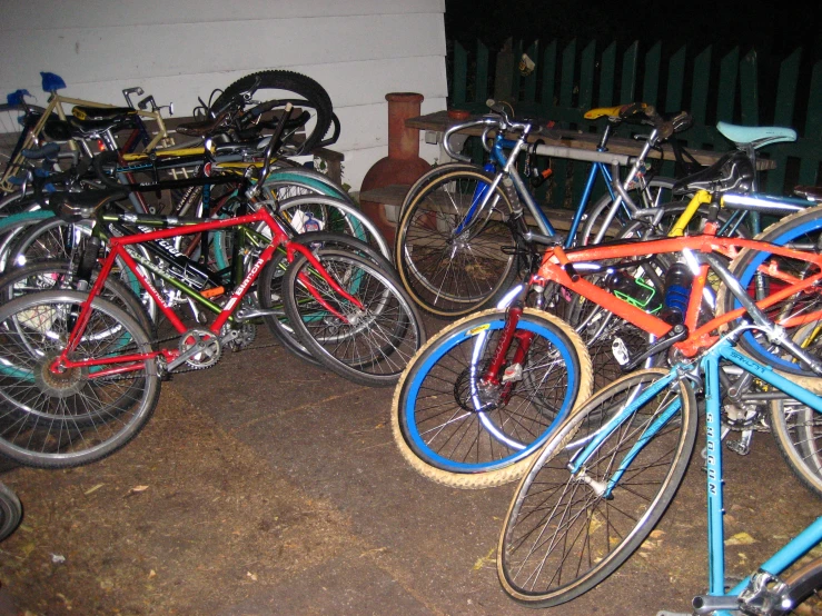 a bunch of bikes that are standing together