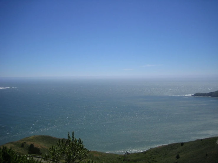 a blue sky is seen over the ocean