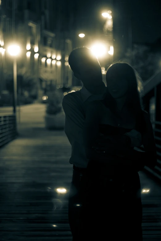 a couple emce as they stand on a pier