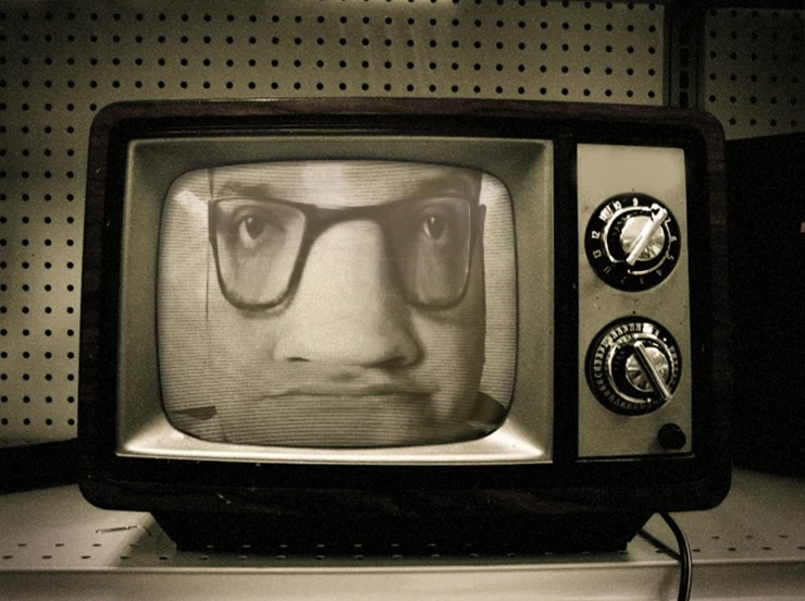 an old television with a face on it