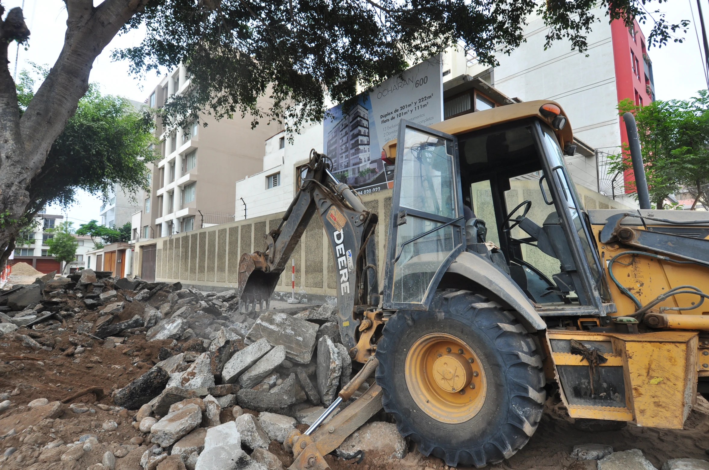 the bulldozer is dumping up rubble outside