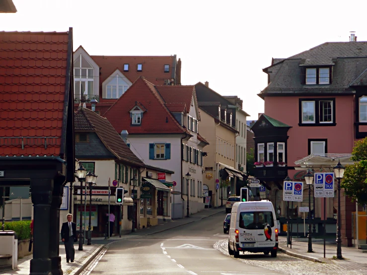 a bus going down a street lined with buildings