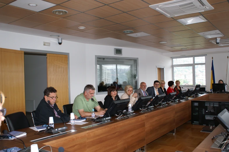 group of people in a conference room meeting