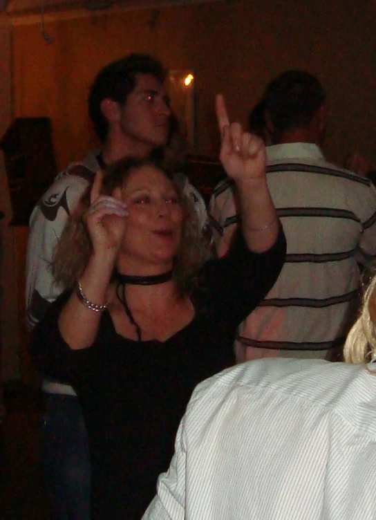 two women on a dance floor in front of several people