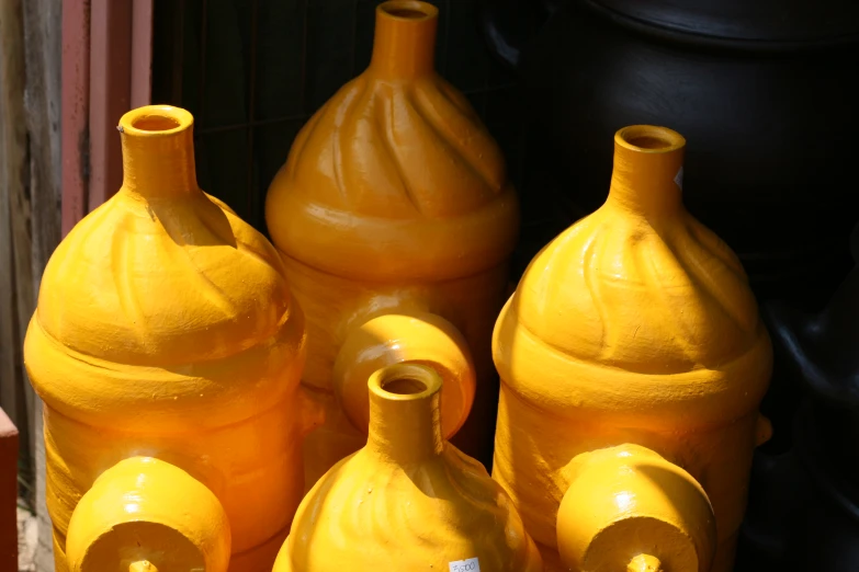 there are lots of vases lined up in the store