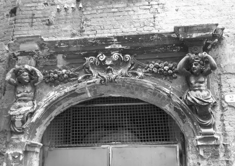 black and white pograph of an old building with an open door