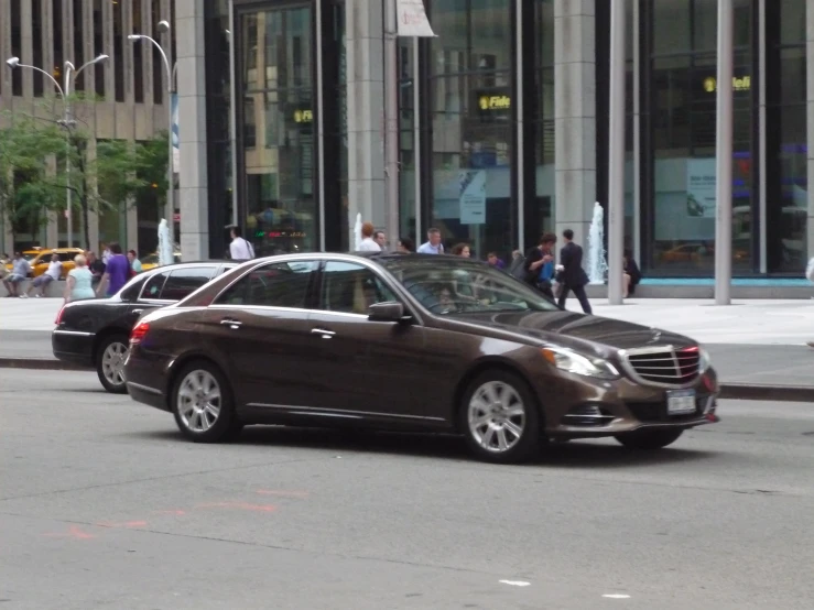 an automatic vehicle drives down a city street