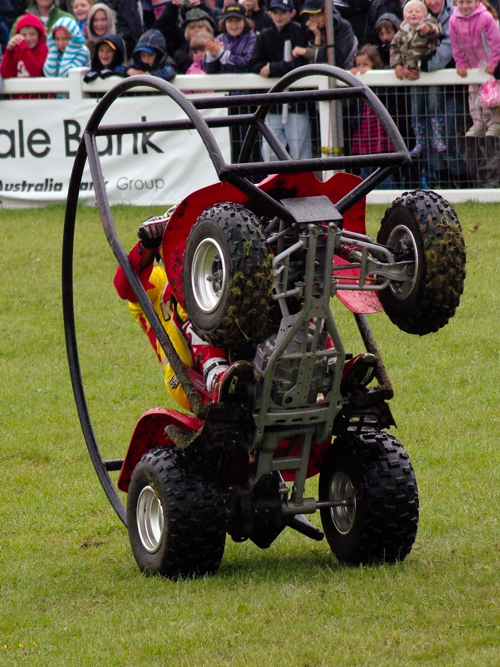 a vehicle pulling around an obstacle in a field