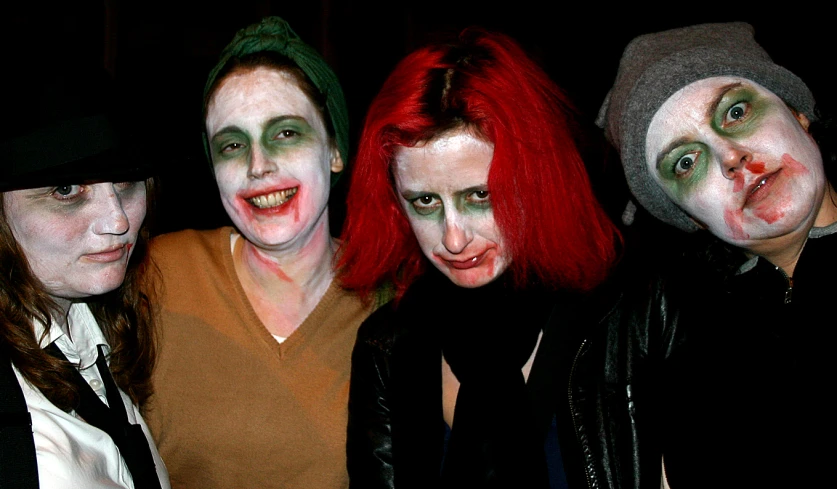 three men and two women with face paint in different poses