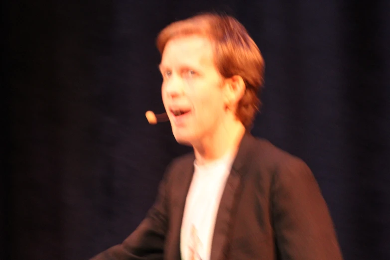 a man in black blazer and white shirt in motion