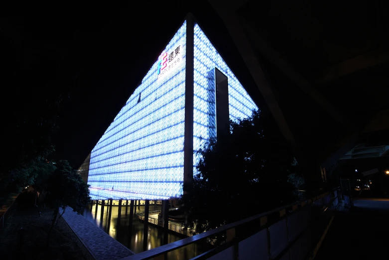 a modern building lit up for the holidays