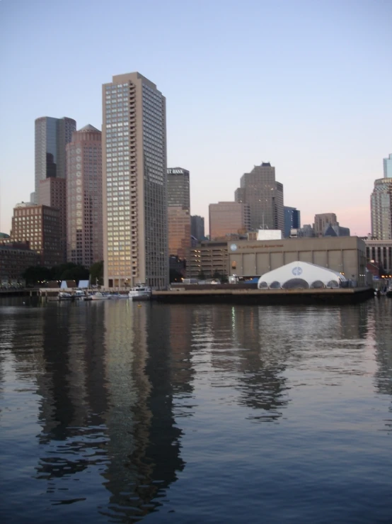 a large body of water with a city in the background