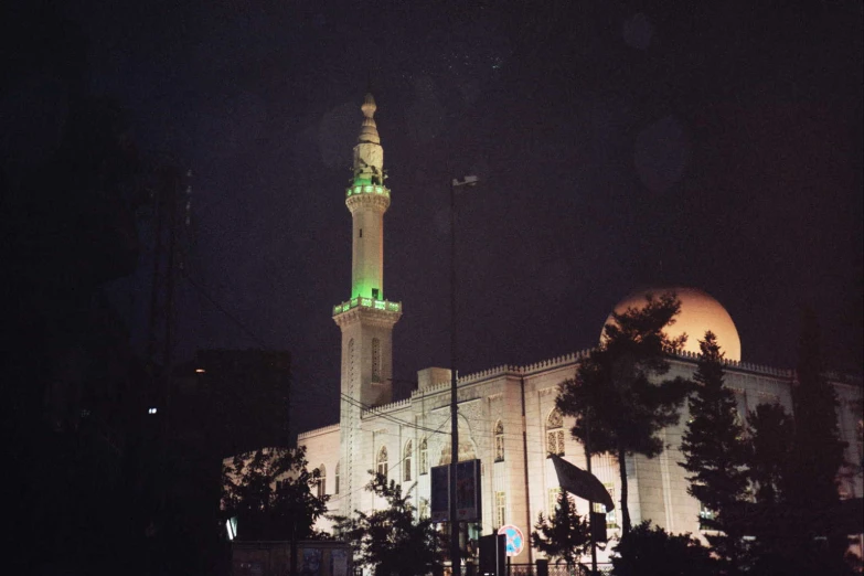 a large white building lit up with lights