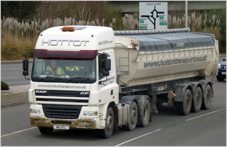 there is a large dump truck on the road